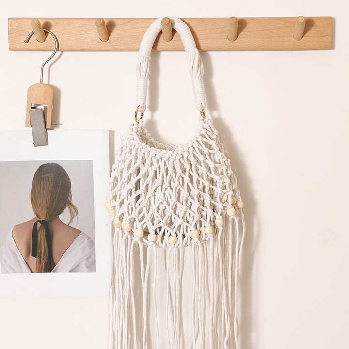 Macrame bag with decorative fringes and wooden beads Bowlift