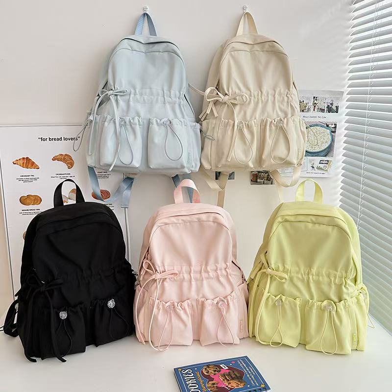 City backpack with innovative compartment system and adjustable carrying straps Bowlift