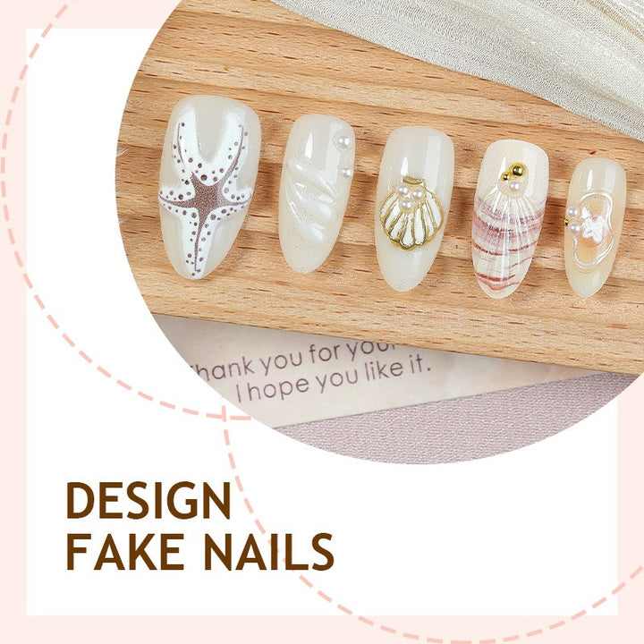 luxurious artificial nail set with maritime designs and golden accents Bowlift