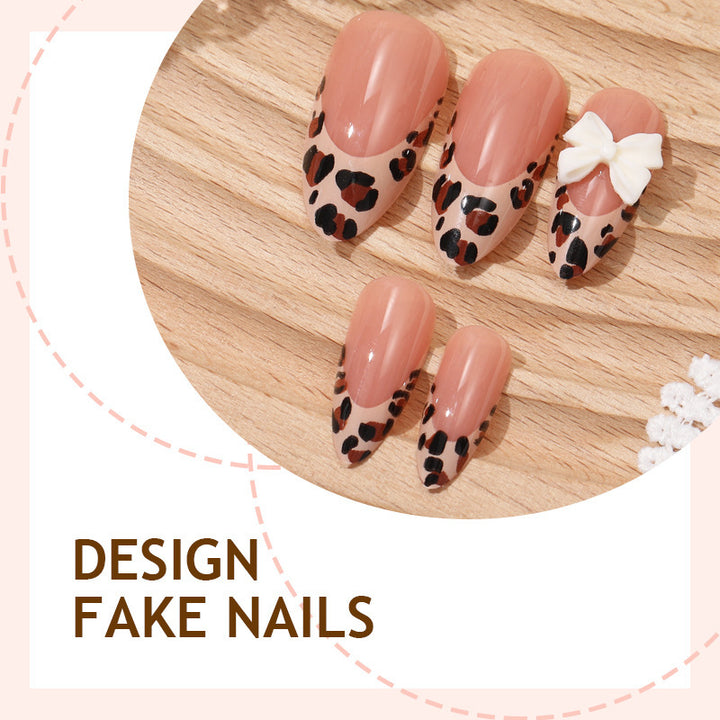 Creative nail art set with vibrant leopard pattern and delicate ribbons Bowlift