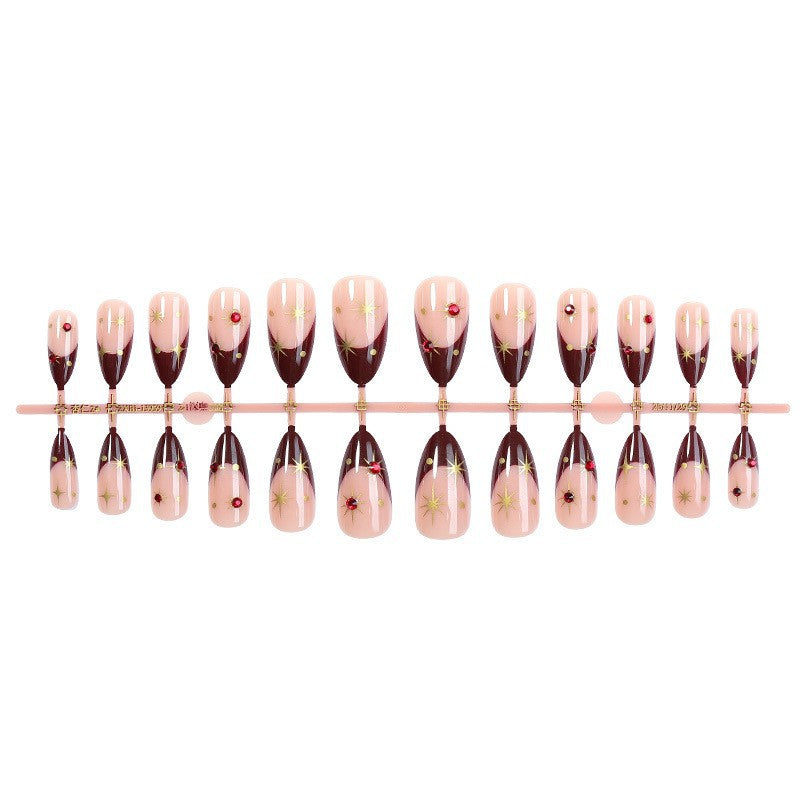 Elegant Pointed Press-On Nail Set with Decorative Accents Bowlift