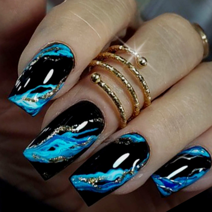 Artistic Acrylic Nail Extensions with Gold Accents Bowlift