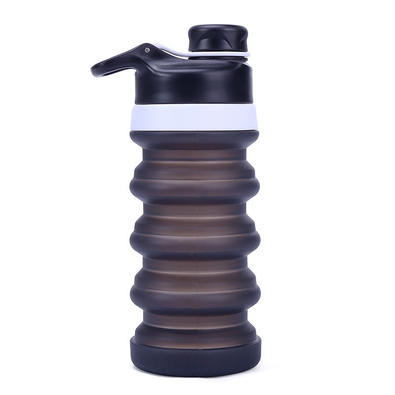 Collapsible silicone water bottle with ergonomic ribbed grip and flip-top spout Bowlift