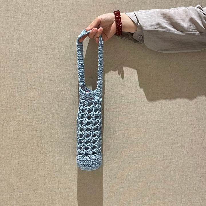 Hand-knotted bottle carrier Bowlift