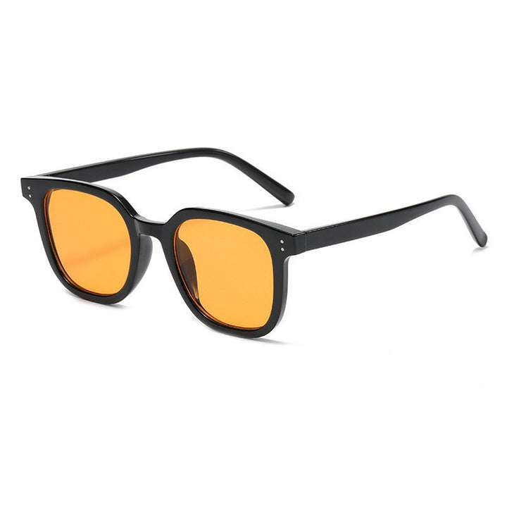 Women striking retro sunglasses with yellow-tinted lenses Bowlift