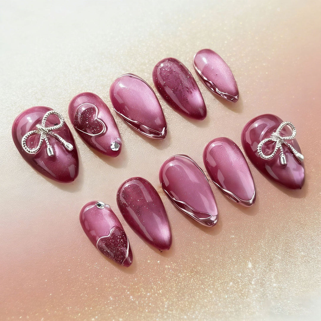 Acrylic nail set with elegant heart and bow decorations Bowlift