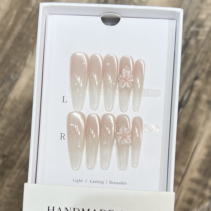 Elegant Stiletto Nail Extensions with Floral Accents Bowlift