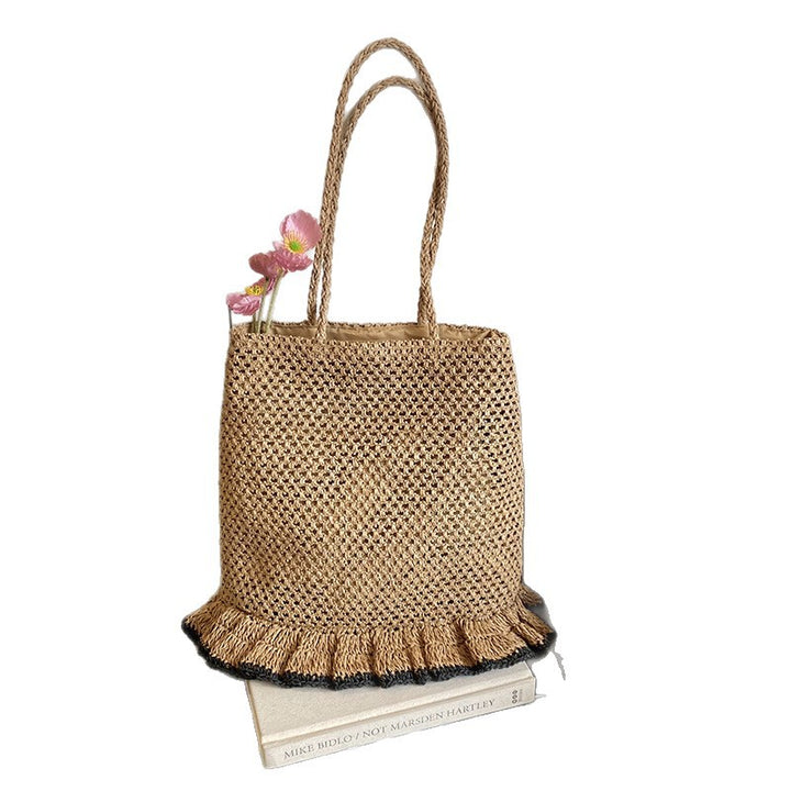 Handcrafted straw bag with fringed hem Bowlift