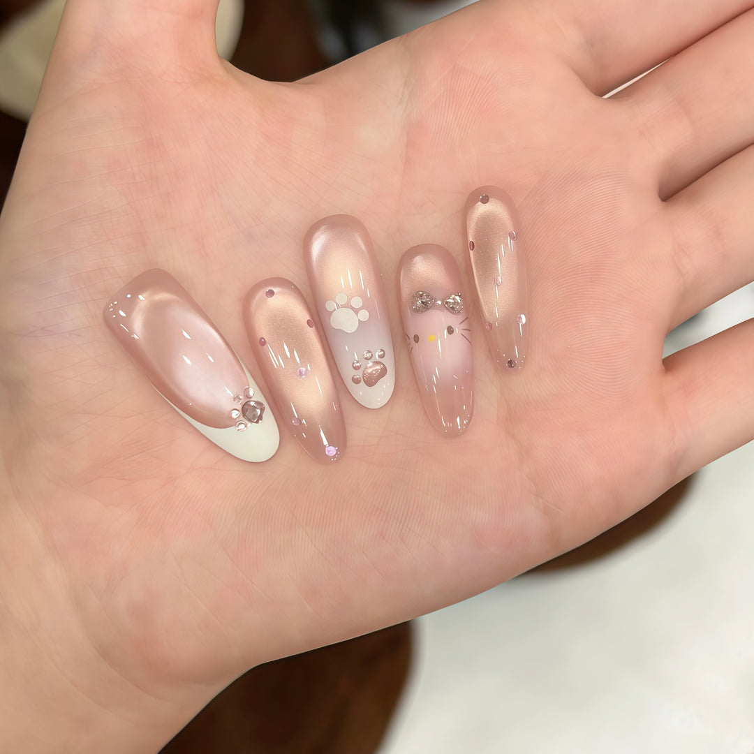 Artificial nail tips with playful penguin and paw print design Bowlift