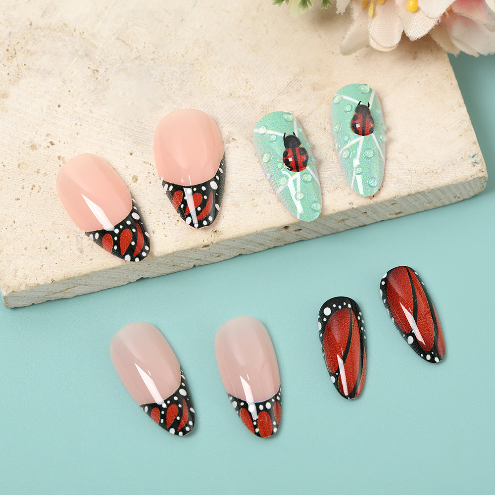 Creative nail art with elaborate butterfly and flower designs Bowlift