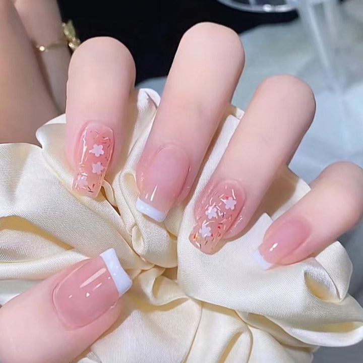 Nail art set with floral decorations and elegant French design Bowlift