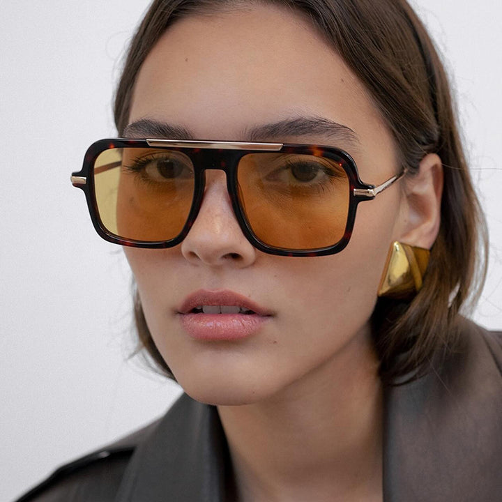 Women's square designer sunglasses with gold accents and protective UV filter Bowlift