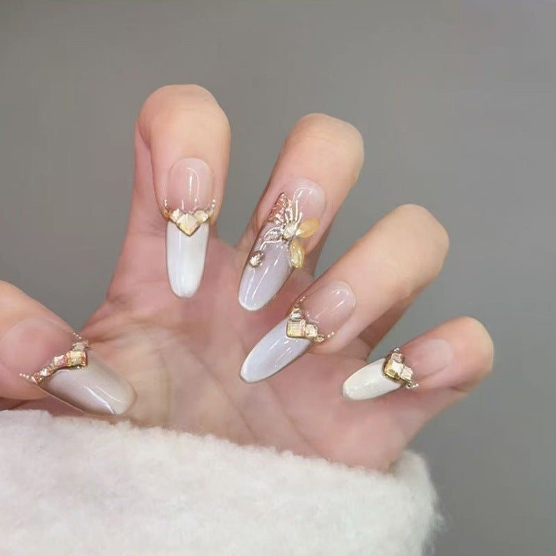Glamorous art nails with elegant golden details Bowlift