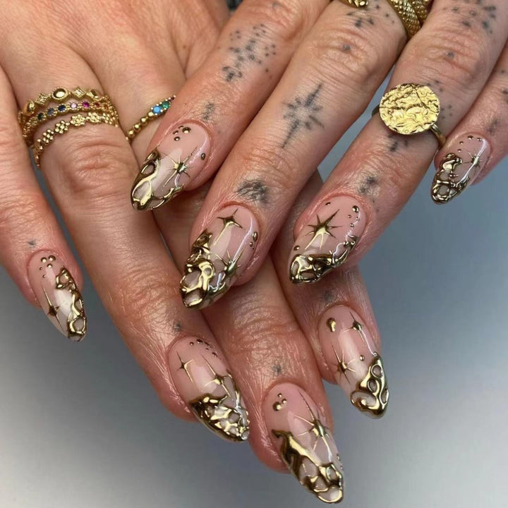 Trendy artificial nail tips with luxurious gold accents Bowlift