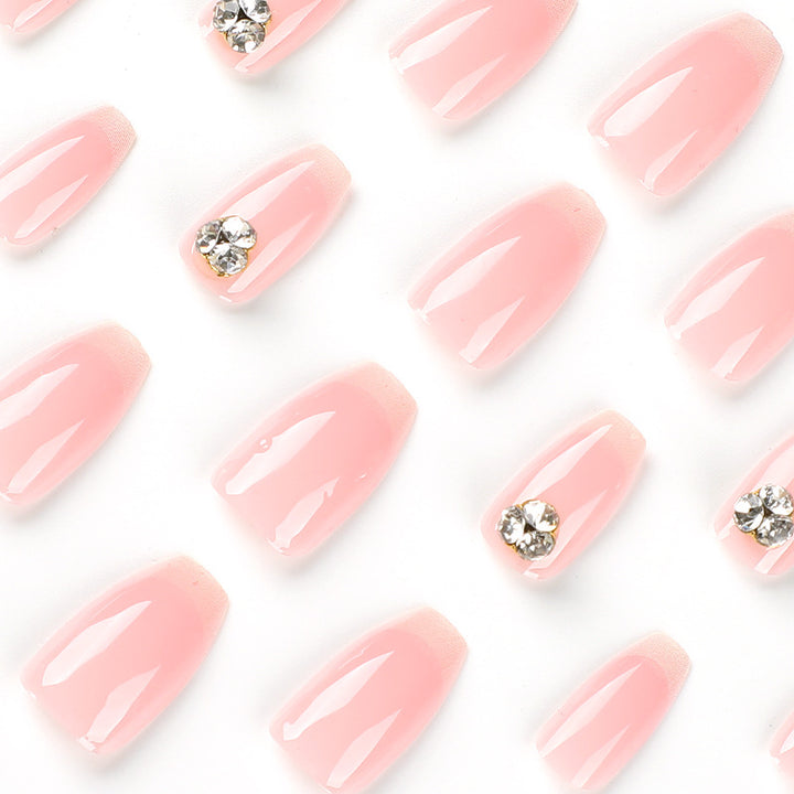 Artful nail extensions with elegant French tip and rhinestone embellishments Bowlift
