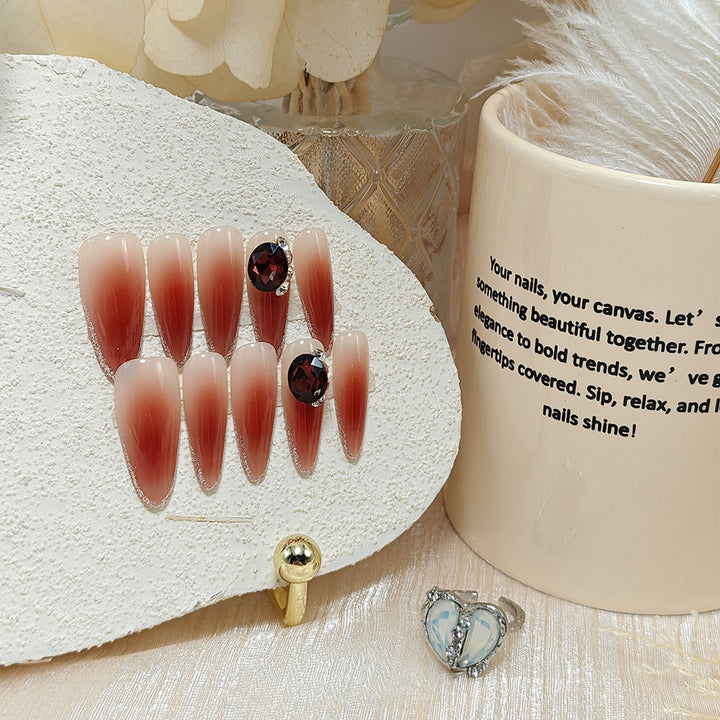 Elegant artificial nails with rhinestone applications Bowlift