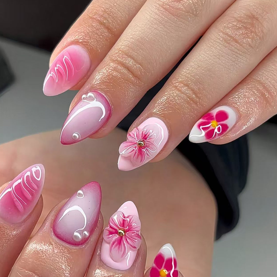Artificial nail set with delicate flower designs and shimmering accents Bowlift