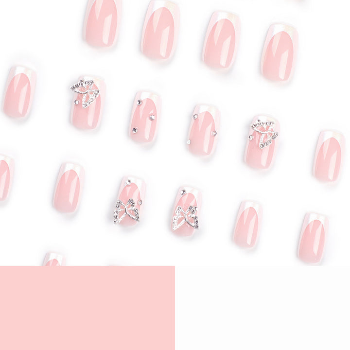 Elegant Nail Art with Glitter and Floral Accents Bowlift