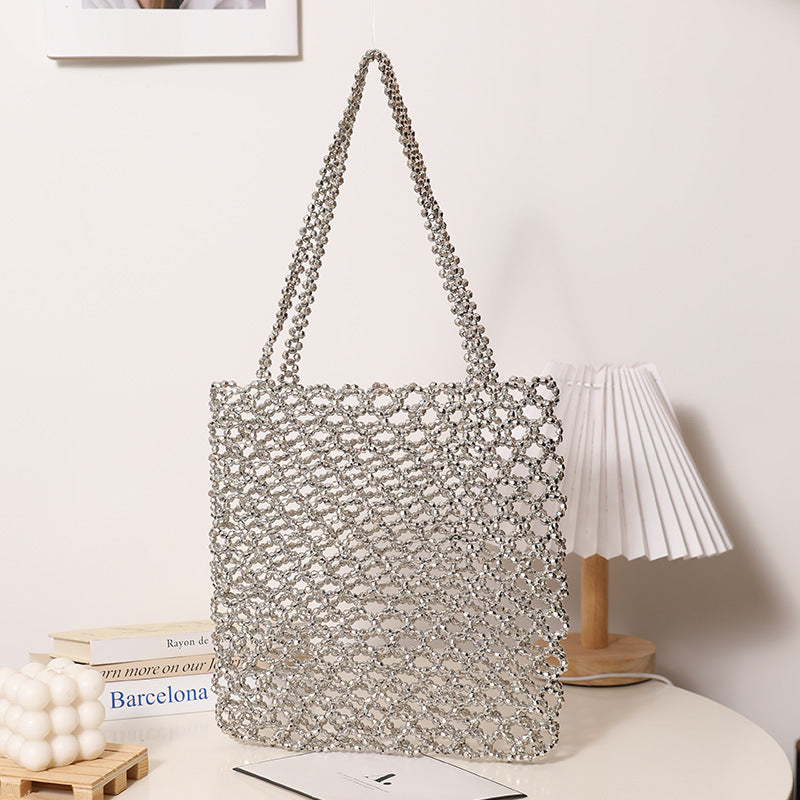 Sparkling Net Handbag Made of Braided Material Bowlift
