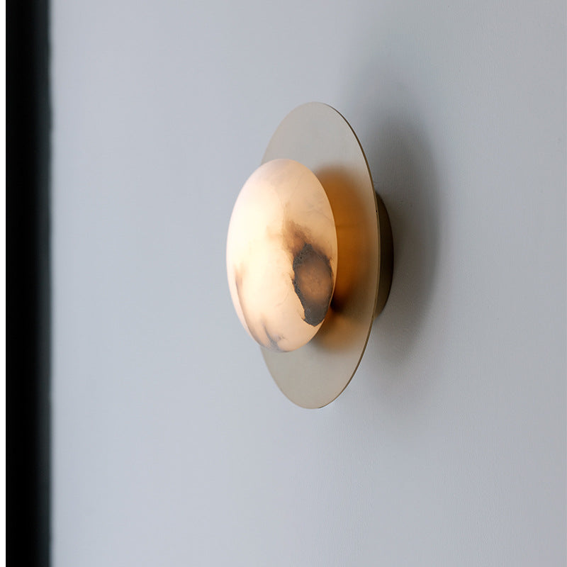Contemporary alabaster globe wall sconce with round metal backplate Bowlift