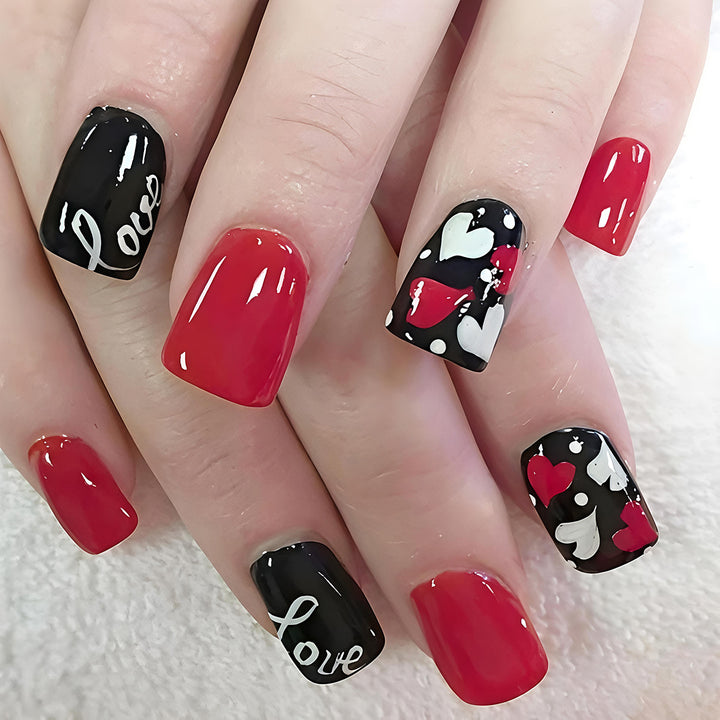 Acrylic nail design with hearts and kiss motifs Bowlift