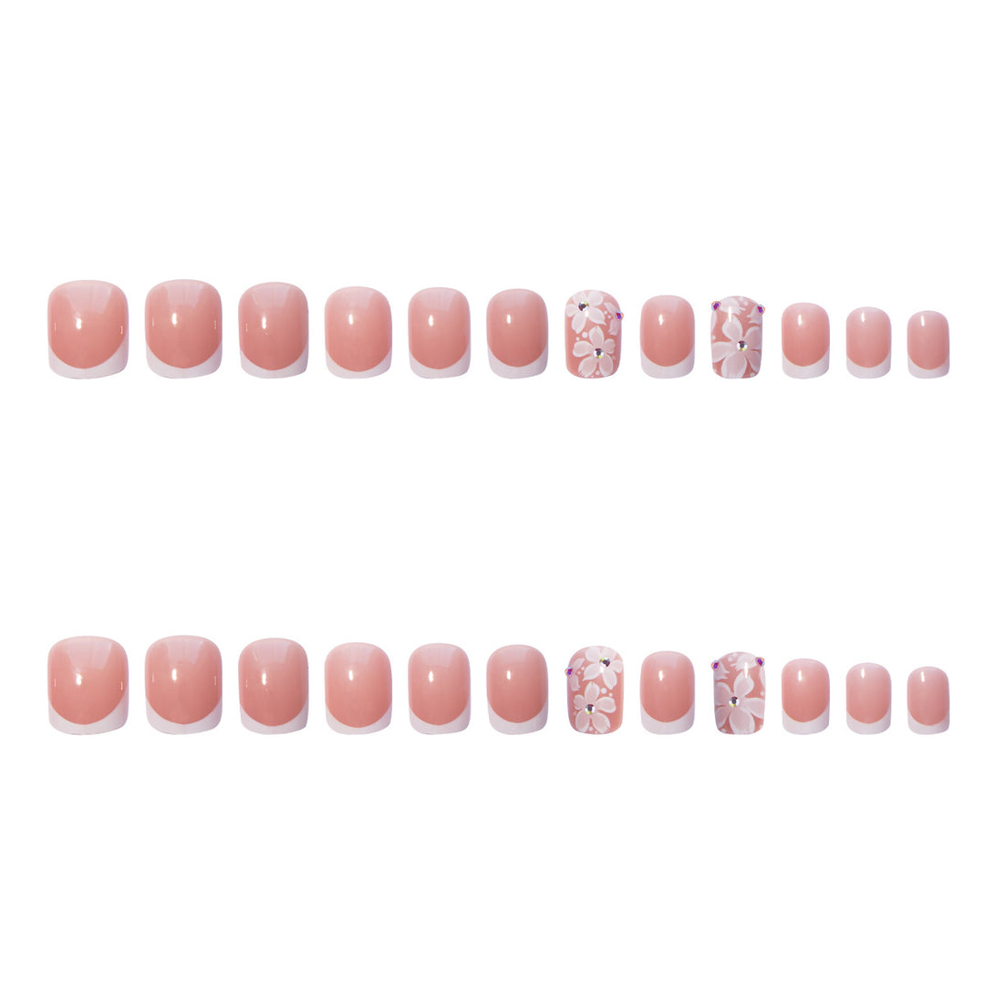 Artificial nail set with elegant French design and floral accents Bowlift