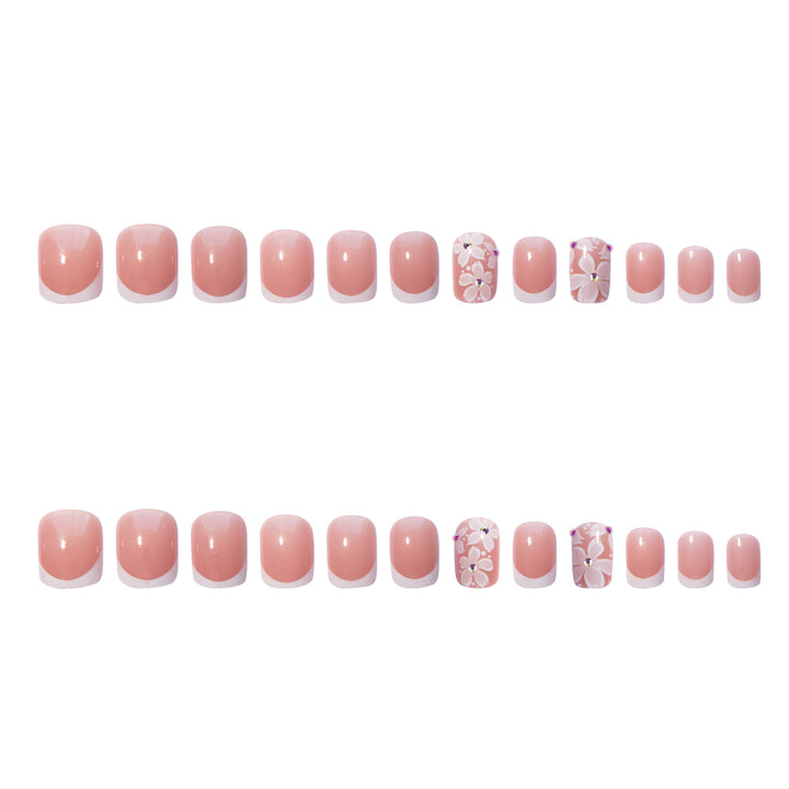 Artificial nail set with elegant French design and floral accents Bowlift