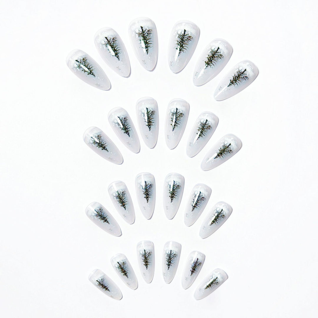 Elegant artificial nails with wintery Christmas tree motif Bowlift