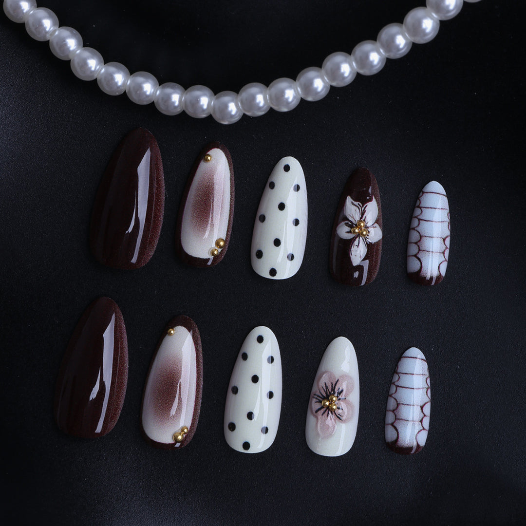 Designer artificial nails with floral and geometric accents Bowlift