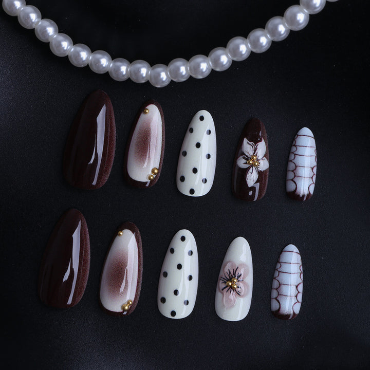 Designer artificial nails with floral and geometric accents Bowlift