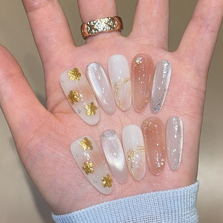 Artificial nails with floral decorations and glitter effects Bowlift