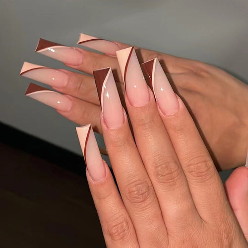 Artful stiletto nails with elegant gradient and geometric accents Bowlift