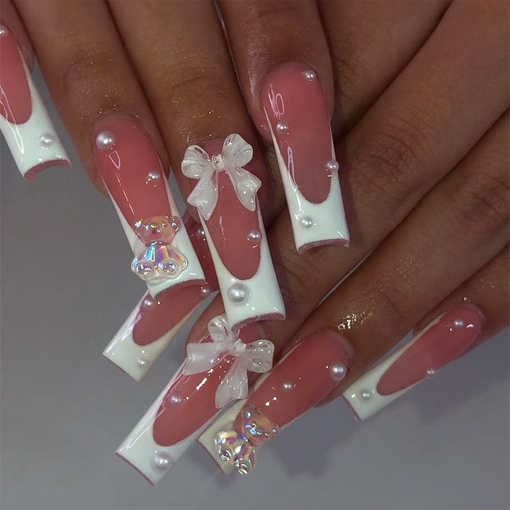 Creative acrylic nail set with delicate pearl and gloss accents Bowlift