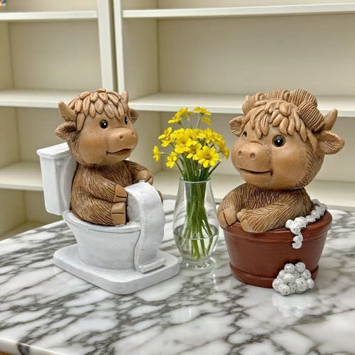 Funny decorative figure of a Highland cow on toilet Bowlift