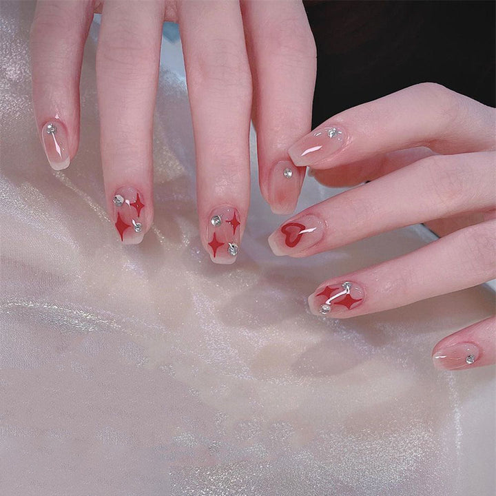 Acrylic nail set with sparkling rhinestone embellishments Bowlift