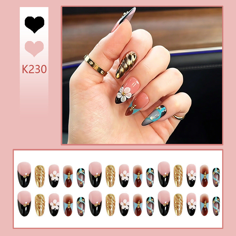 Artificial nail set with filigree floral decorations and glamorous accents Bowlift