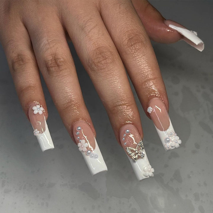 Nail art set with charming flower and butterfly accents Bowlift