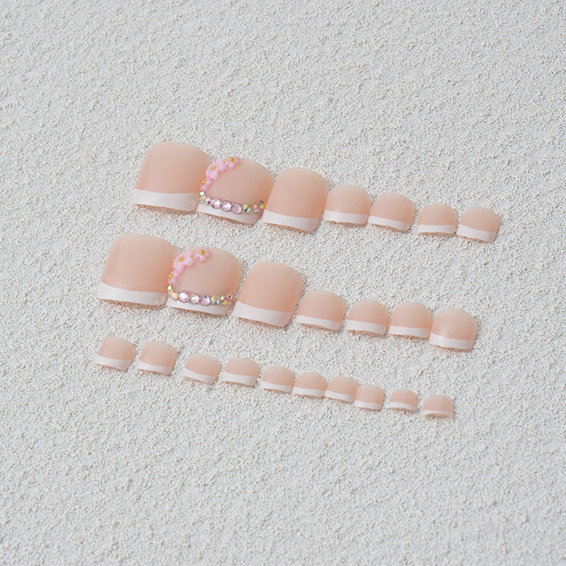 Elegant toenail art with delicate 3D floral decorations Bowlift