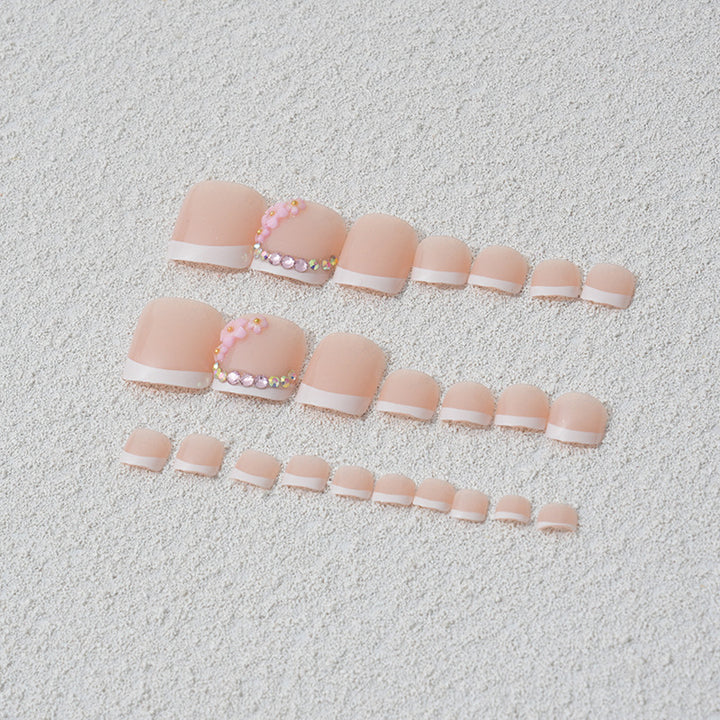 Elegant toenail art with delicate 3D floral decorations Bowlift