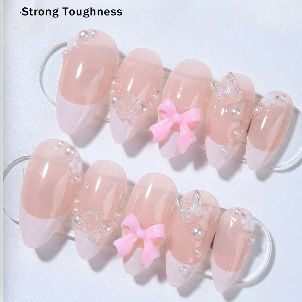 Artificial nail set with romantic flower and glitter accents Bowlift