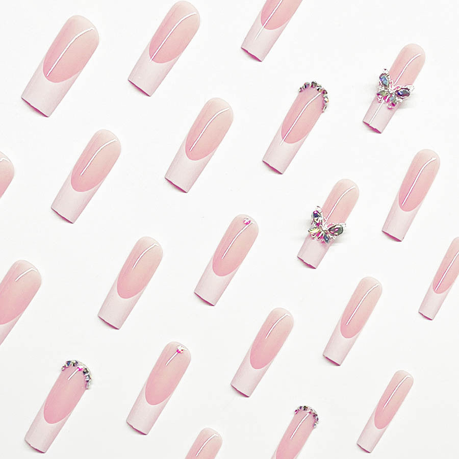 Acrylic nail set with elegant design and sparkling rhinestone accents Bowlift