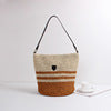 Braided shoulder bag with stylish accent Bowlift