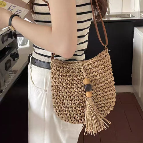Handwoven shoulder bag with tassels and wooden details Bowlift