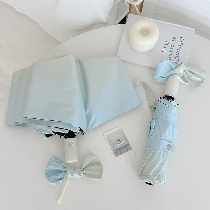 Women's Folding Travel Umbrella with Practical Storage System Bowlift