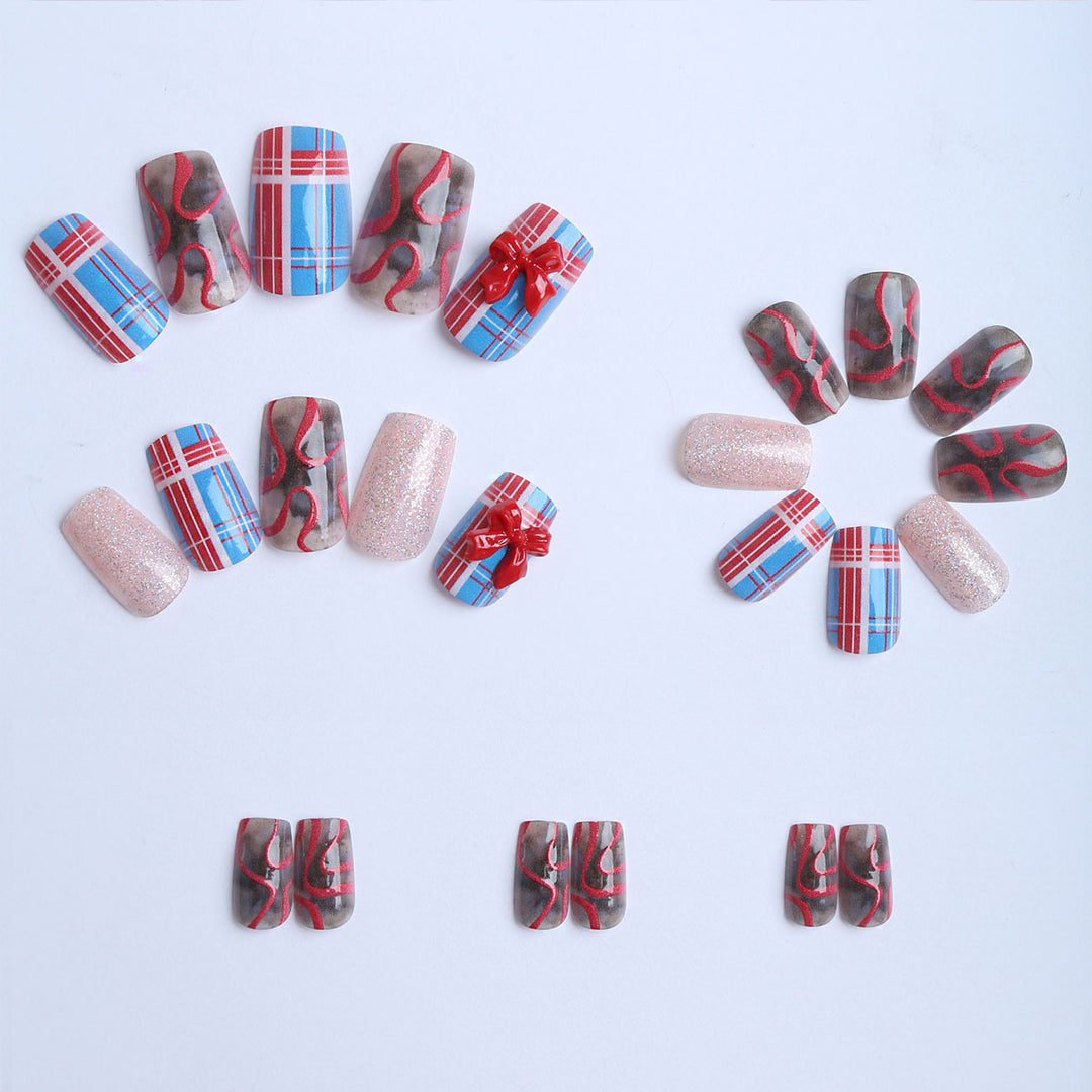 Artificial nails with festive gift design and glitter Bowlift