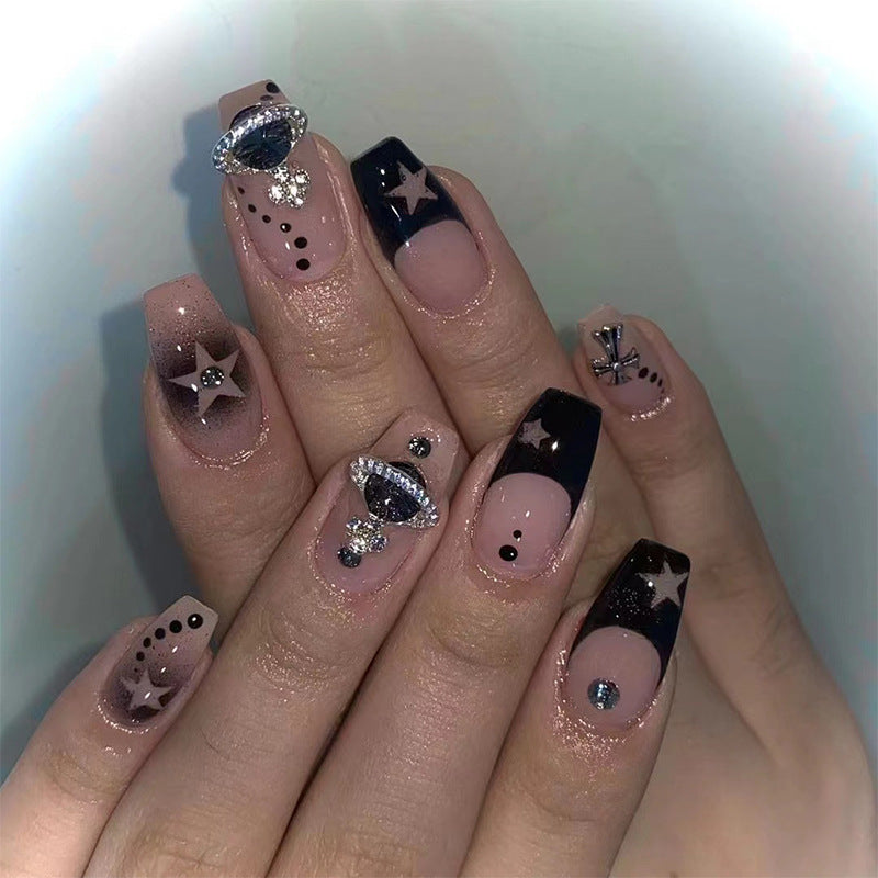 Glamorous nail art with star motifs and glitter accents Bowlift