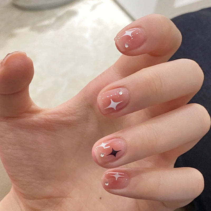 Acrylic nail set with sparkling star decorations and elegant accents Bowlift