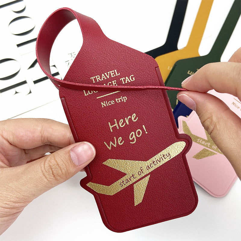 premium leather travel luggage ID tag with embossed airplane motif and adjustable strap Bowlift