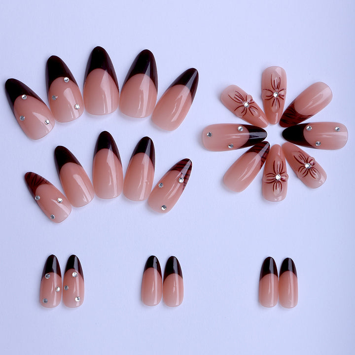 Artificial nails with elegant flower design and glitter accents Bowlift