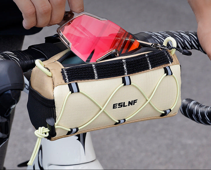 compact cylindrical handlebar bag with elastic bungee and universal Velcro mount Bowlift